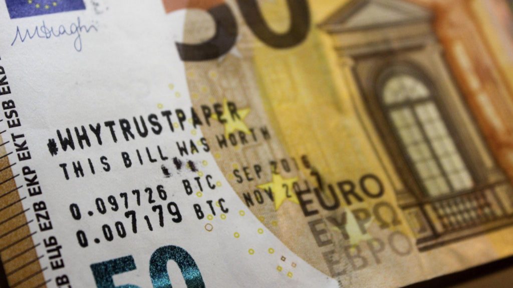 IMAGE: 50 Euro bill with bitcoin annotation 