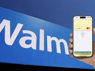 IMAGE: A hand using Apple Pay on top of the Walmart logo.